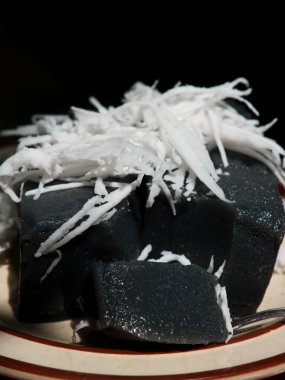 Kanom tepe Poon(black coconut sweet pudding)