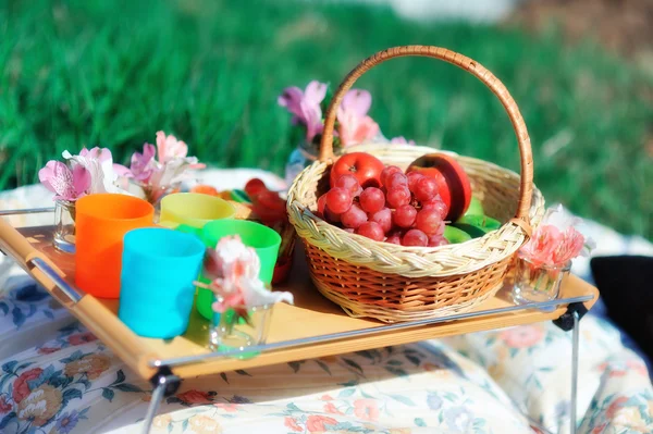 Basket with fruit and flowers — Stock Photo, Image