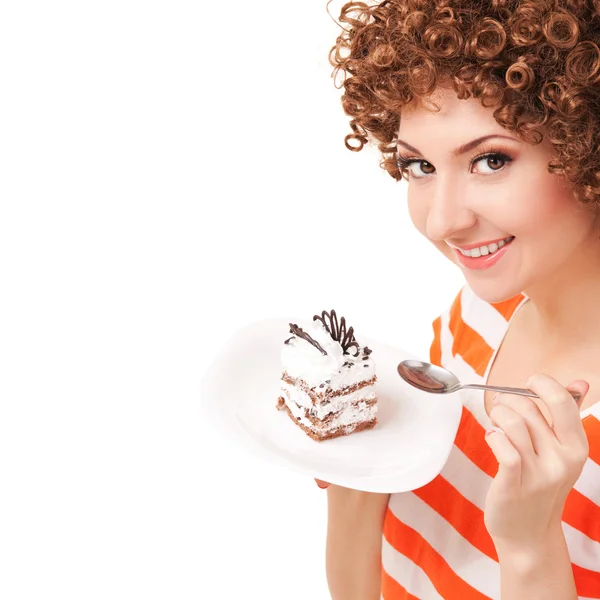 Zábava žena jíst dort na bílém pozadí — Stock fotografie