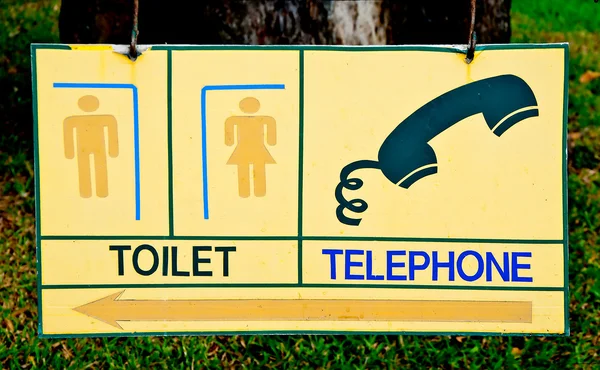 O Símbolo do banheiro e telefone — Fotografia de Stock