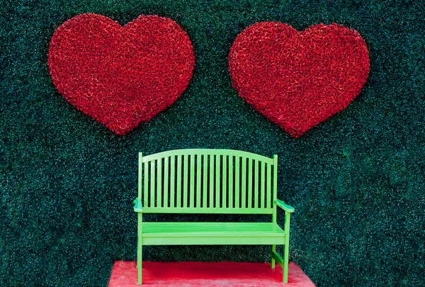 The Green bench with red heart background — Stock Photo, Image