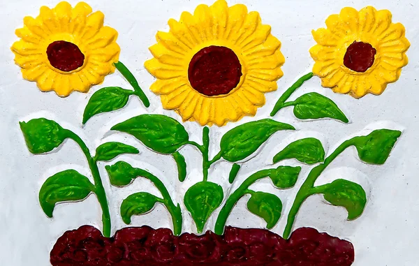 The Ceramic of sunflower on wall background — Stock Photo, Image