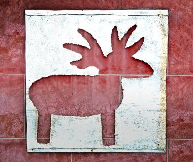 The Drilled reindeer on iron sheet background clipart