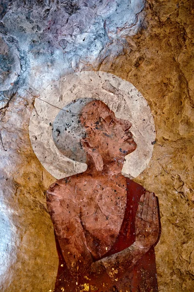 The Old painting of buddha status in cave — Stock Photo, Image
