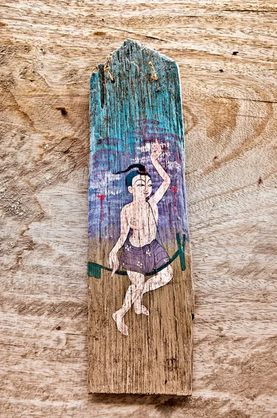 Il Vecchio dipinto su legno isolato su fondo legno — Foto Stock