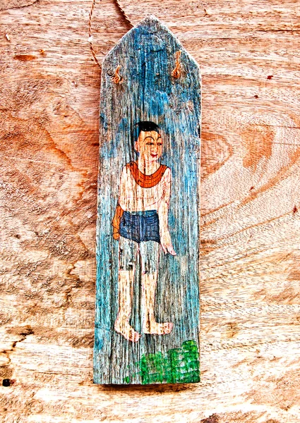 The Old painting on wood isolated on wood background