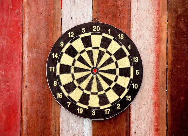 The Dartboard on wood background — Stock Photo, Image