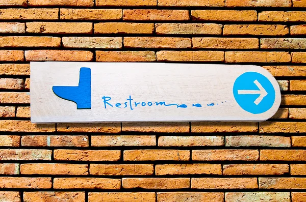 The Sign of restroom on wall background — Stock Photo, Image