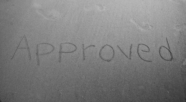 The Word of approved handwritten in sand — Stock Photo, Image