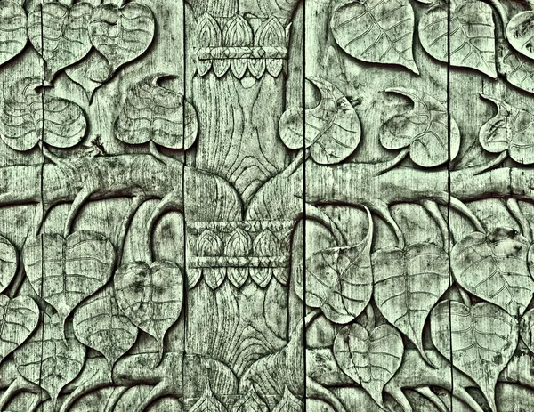 The Carving wood of pattern leaf poh tree — Stock Photo, Image