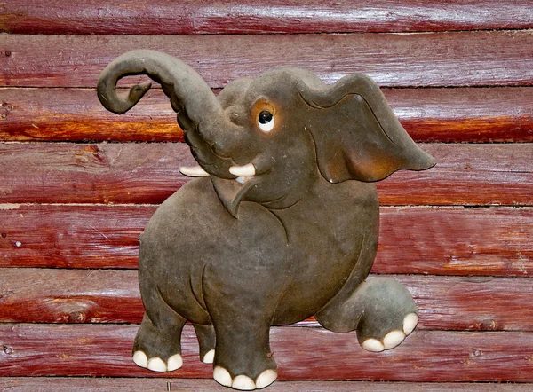 De houten olifant op hout achtergrond — Stockfoto