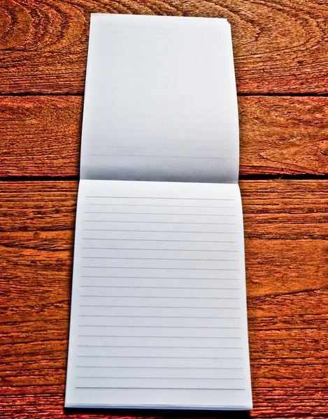 The Blank of white paper on wood background — Stock Photo, Image