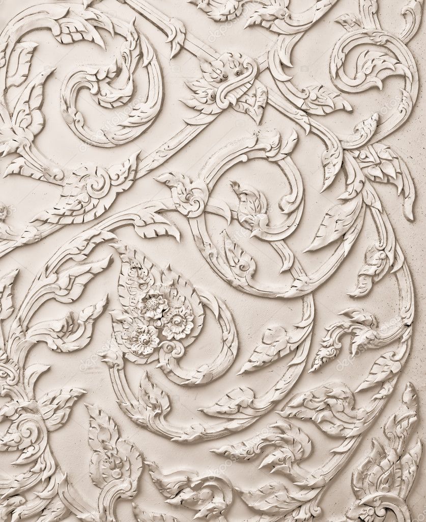 The White stucco design of native thai style on the Wall