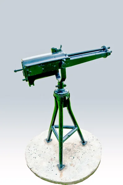Den Vintage maskingevær isoleret på grå baggrund - Stock-foto