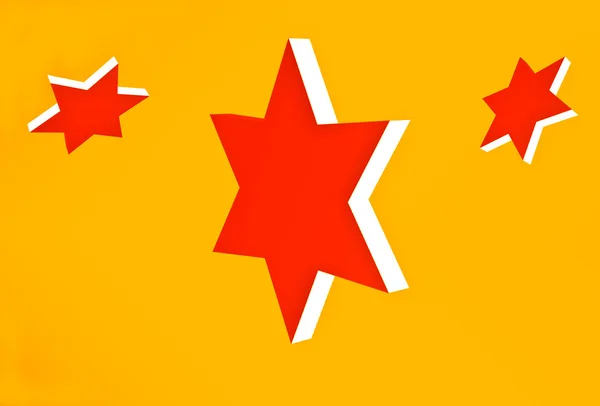 Las tres estrellas rojas sobre fondo amarillo —  Fotos de Stock