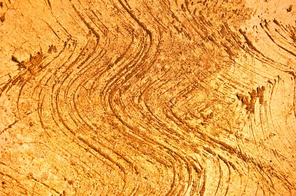 Волновой рисунок на фоне коричневого цементного пола — стоковое фото