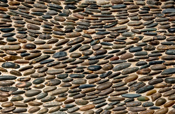 Der abstrakte Hintergrund aus Kieselsteinen — Stockfoto