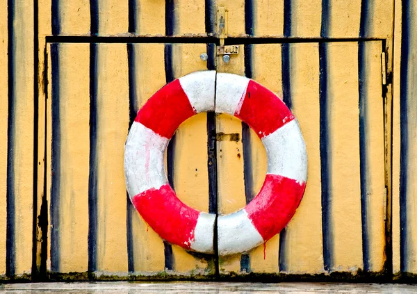 The Sign of Life buoy preserver on wood