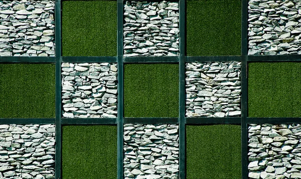 Abstrato de grama artificial com pedra — Fotografia de Stock