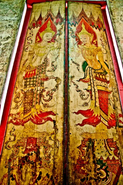 Il dipinto tailandese sulla porta di legno nel tempio — Foto Stock