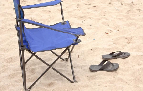 Folding chair and slippers. — Stock Photo, Image