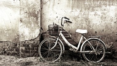 Old bicycle and cracked wall clipart