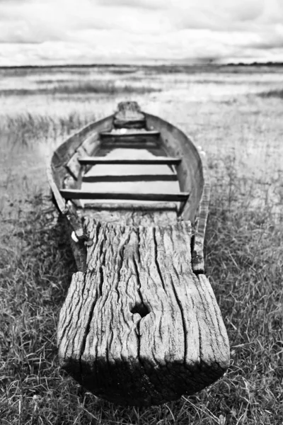 stock image Abandoned native Thai style wood boat in black and white