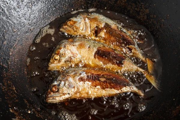 stock image Fish frying in hot oil