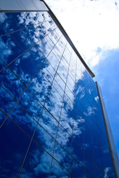 Clouds reflectionon on office building — Stock Photo, Image