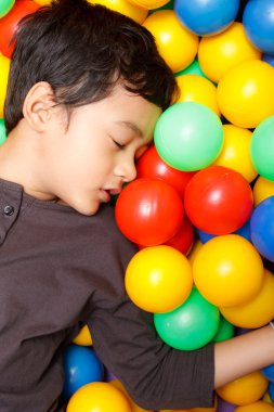 Asian boy and colorful small ball