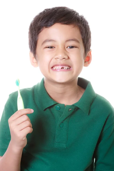 Junge und Zahnbürste — Stockfoto