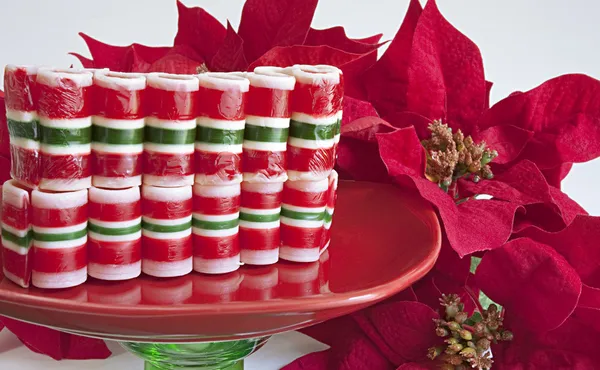 Nastro caramelle di Natale su bianco Foto Stock Royalty Free