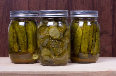 Jars of fresh preserved pickles clipart