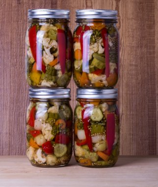Mixed vegetables preserved in jars clipart