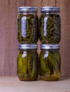 Beans and pickles preserved in mason jars clipart