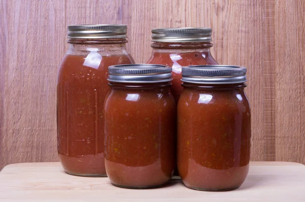 Fresh tomato sauce in jars — Stock Photo, Image
