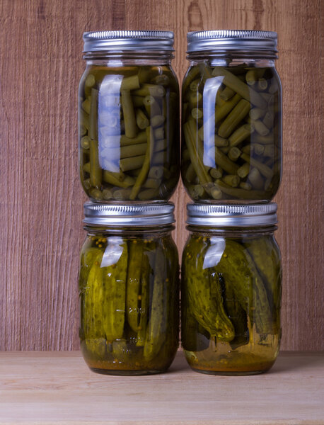 Beans and pickles preserved in mason jars