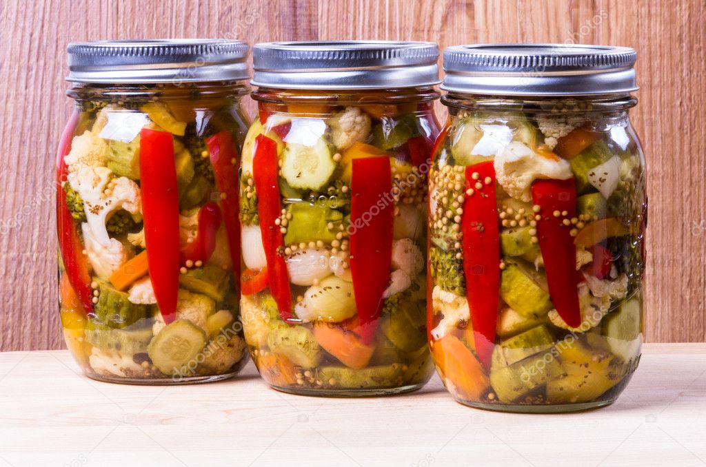 Three jars of preserved mixed vegetables