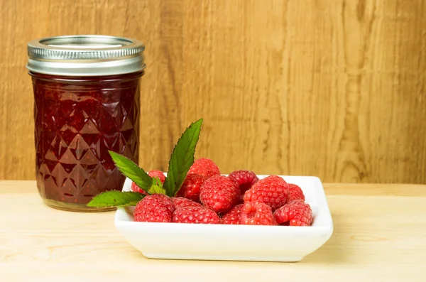 Red raspberries mint and jam or jelly — Stock Photo, Image