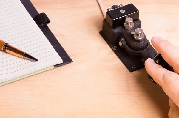 Telegraph key and notebook — Stock Photo, Image