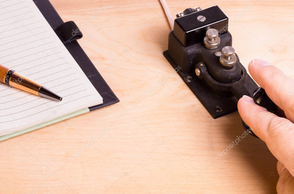 Telegraph key and notebook