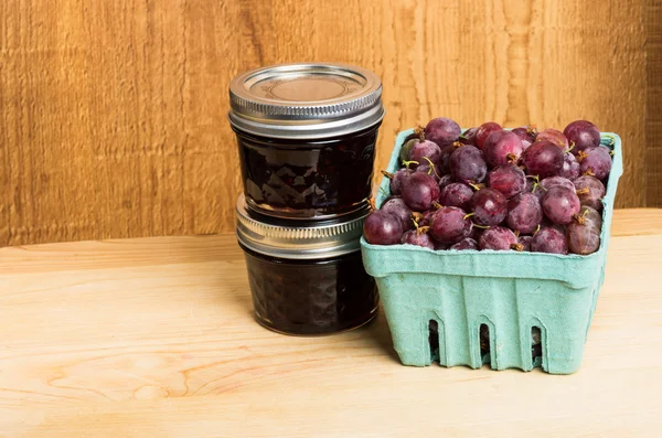 Gooseberry jam and red gooseberries — Stock Photo, Image