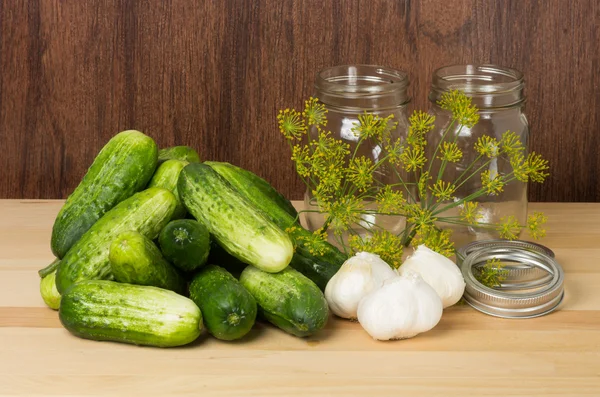 Pickles with jars and garlic — Stock Photo, Image
