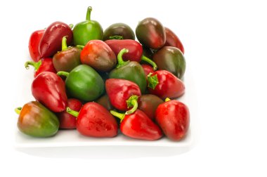 Cherry peppers on white plate clipart
