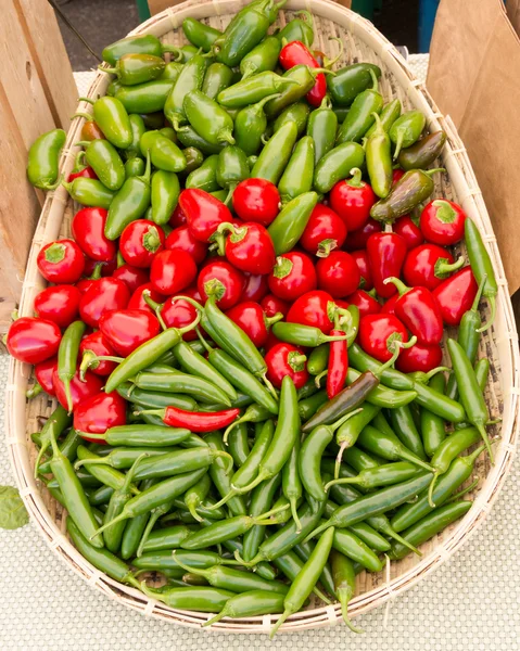 Basket of peppers at the market — Stock Photo, Image