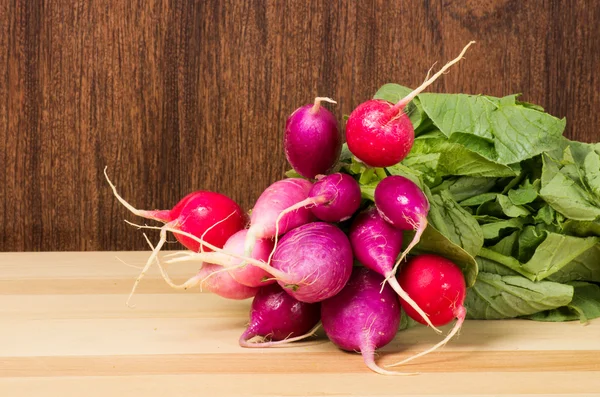 Red radishes bunched in the kitchen — Stock Photo, Image
