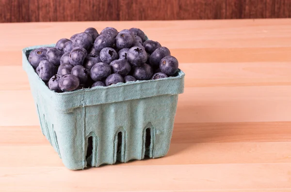 Blueberries in container on table — Stock Photo, Image