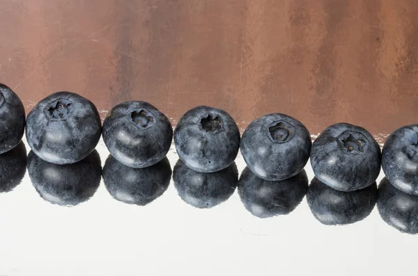 Row of blueberries on table — Stock Photo, Image