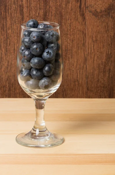Wine glass full of blueberries — Stock Photo, Image