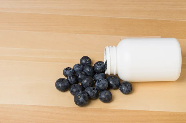 Blueberries as vitamins — Stock Photo, Image